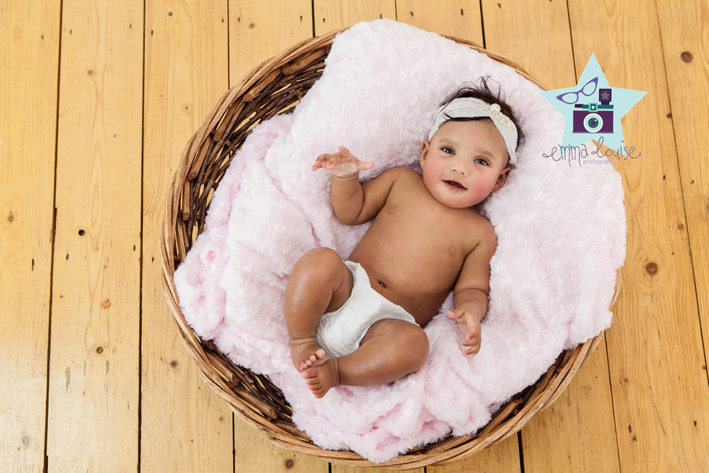Baby posed in a basket for Baby Photography Bromley